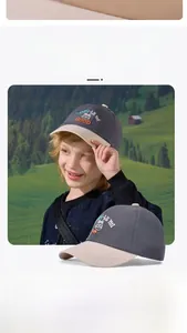 Detail of children's baseball cap featuring teddy bear embroidery and color-block design