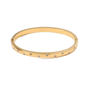 Luxury gold plated stainless steel hinged bangle featuring ten sparkling inlaid crystals