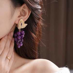 Vintage French style purple beaded grape earrings with gold leaf rhinestones on model