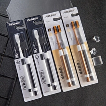 Close-up of Pasa soft bristle toothbrushes featuring charcoal tips in dual-pack packaging