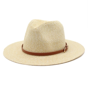 Straw Panama hat with brown leather band and gold buckle on a clean white background
