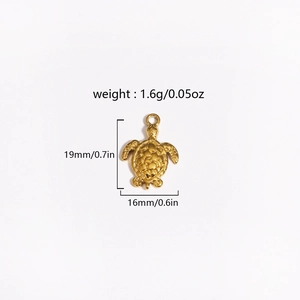 Macro view of golden turtle pendant showing 19mm height and 16mm width dimensions