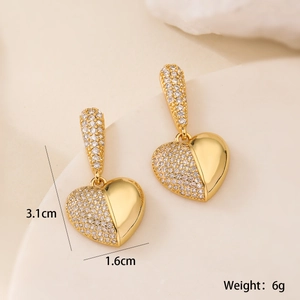 Detailed view showing 3.1cm length and 1.6cm width of 18K gold plated heart earrings