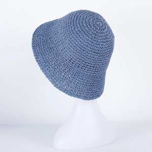 Detailed blue crochet texture of this summer straw bucket hat on a white mannequin head