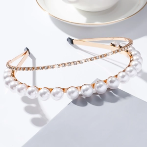 Close-up of elegant double-layered headband with white pearls and sparkling rhinestones