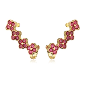 Luxurious gold-plated four-leaf clover ear cuffs with vibrant magenta crystals