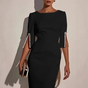 Elegant slim-fit black midi dress with pearl-beaded slit sleeves for a formal commute