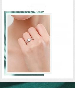Detailed close-up of a 925 silver ring with oval zircon and twisted chain texture band