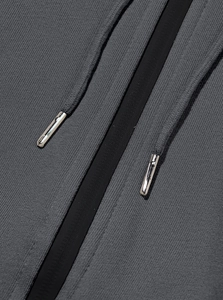 Detail of dark grey fleece hoodie with high-density knit fabric and metal drawstring tips