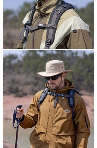 Detail of a brown outdoor windbreaker with adventure logo and large utility pockets