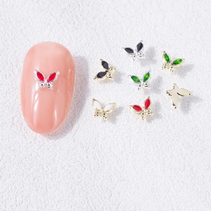Macro shot of 3D alloy butterfly nail charms in various colors for manicure decor