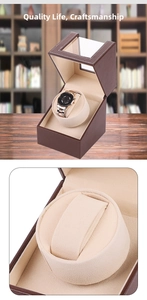 Detailed view of brown leather single watch winder with transparent window and soft beige lining