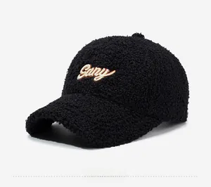 Detail view of black sherpa baseball cap featuring beige Gary letter embroidery