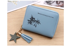 Detail of light blue PU leather coin purse with bamboo print and star tassel zipper