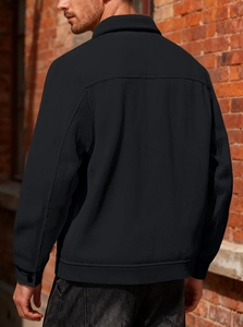 Rear view of men's black corduroy shirt jacket showing vertical texture and back yoke seam