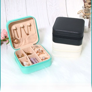 Detail view of mini PU leather jewelry box showing necklace hooks and ring slots