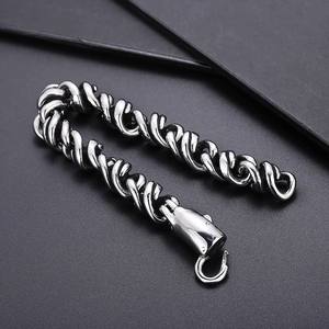 Close-up of silver twisted rope chain bracelet with a sturdy lobster claw clasp