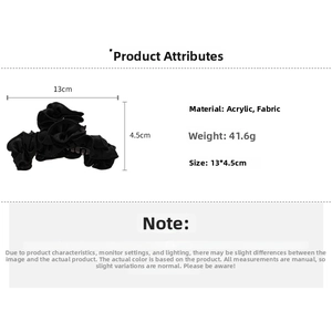 Detail of black fabric ruffle hair claw clip with 13cm length and 41.6g weight specs