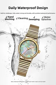 Detail showing the waterproof feature of a gold-toned watch with a mother-of-pearl dial