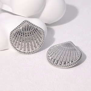 Elegant silver fan-shaped shell earrings in stainless steel with textured metal finish