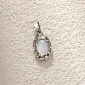 Silver abalone shell pendant with oval white mother of pearl and textured gold frame