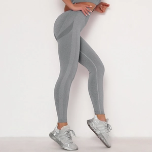 Detail view of high-waist seamless knitted yoga pants with tummy control and peach lift design