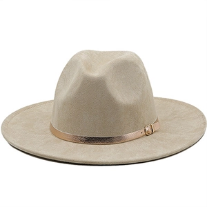 Detail of beige faux suede fedora hat with gold metal buckle and wide brim accent