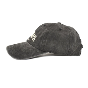 Side view detail of dark gray washed cotton baseball cap with LESS letter embroidery