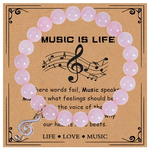 Bracelet musical en jaspe zèbre rose 8mm avec breloque clé de sol sur carte cadeau