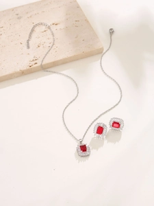 Classic silver jewelry set with red square gemstones and sparkling white crystals