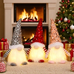 Three glowing Christmas gnomes with sequin hats and warm lights in a cozy room decor