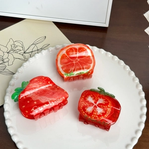 Set of 3 fruit-shaped hair claws including orange, strawberry and tomato designs