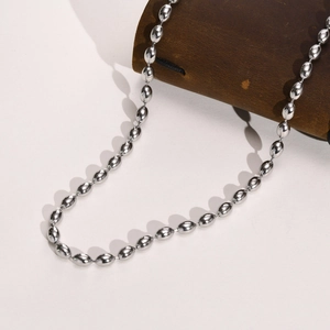 Detailed view of silver oval-bead titanium steel necklace wrapped on leather holder