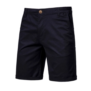 Detailed view of men's cotton shorts featuring elastic waistband and brown button closure