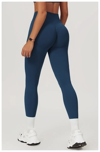 Detailed back view of high-waisted seamless scrunch butt yoga leggings in dark blue color