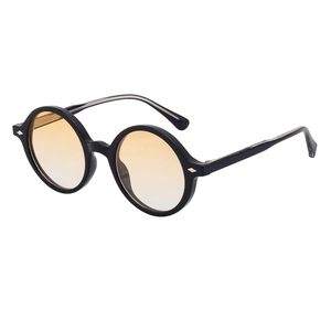 Vintage round black sunglasses with yellow-orange gradient lenses in 45-degree side view