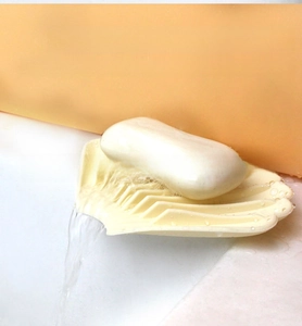 Detail showing the silicone soap dish with a sloping drainage spout for self-draining