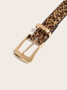 Close-up of leopard print belt with a polished gold rectangular buckle and soft texture
