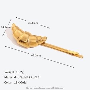 Macro view of 18K gold plated croissant hair clip with size and weight measurements