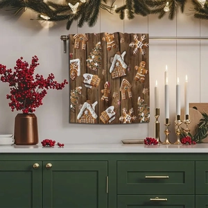 Close-up of microfiber kitchen towel with gingerbread prints hanging in a cozy Christmas kitchen