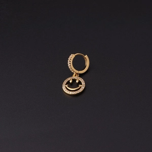 Detail of gold-plated hoop earring featuring a micro-pave zircon smiling face pendant