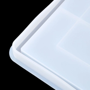 Macro view of flexible silicone tray mold featuring reinforced grid structure and rounded edges