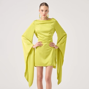 Detailed view of the lime green satin dress featuring elegant extra long flared sleeves