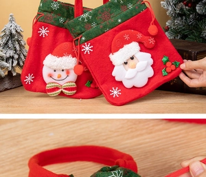Detail of Christmas gift bags with 3D Santa and snowman appliques on red plush fabric