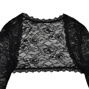 Detail of black floral lace shrug with scalloped edges and intricate mesh texture
