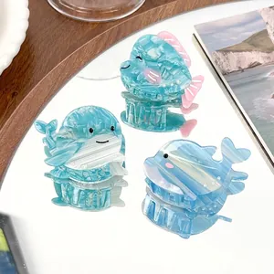 Three-piece ocean animal claw clip set with dolphin and whale acetate marble designs
