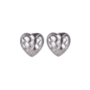 Macro shot of silver heart stud earrings with detailed woven texture design