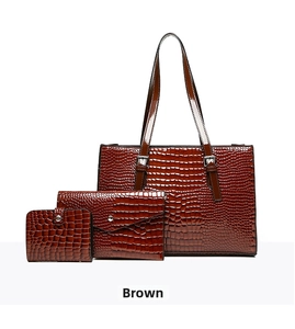 Three-piece brown crocodile embossed tote set including a handbag, envelope clutch, and wallet