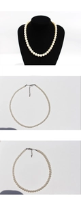 Detailed views of round cream pearl necklace on a black velvet neck bust and white background