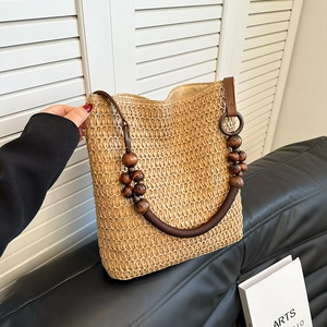Rainbow straw beach bag with wooden bead handle and brown leather details for women